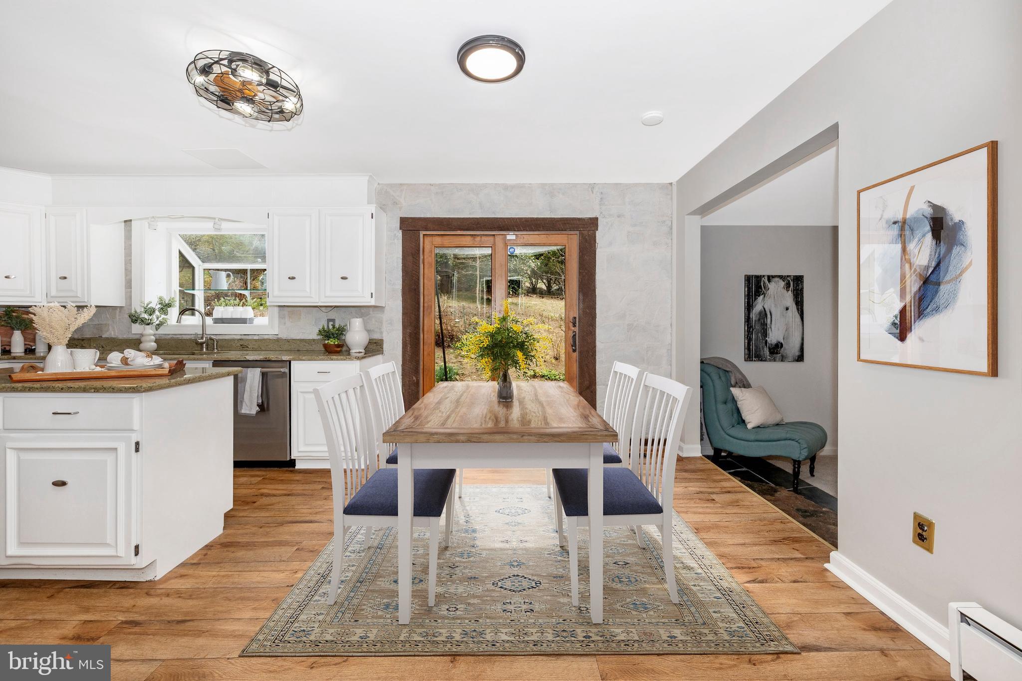 4426 Teen Barnes Road Frederick, MD 21703 - Photo 21 of 76 a living room with stainless steel appliances kitchen island furniture and a rug