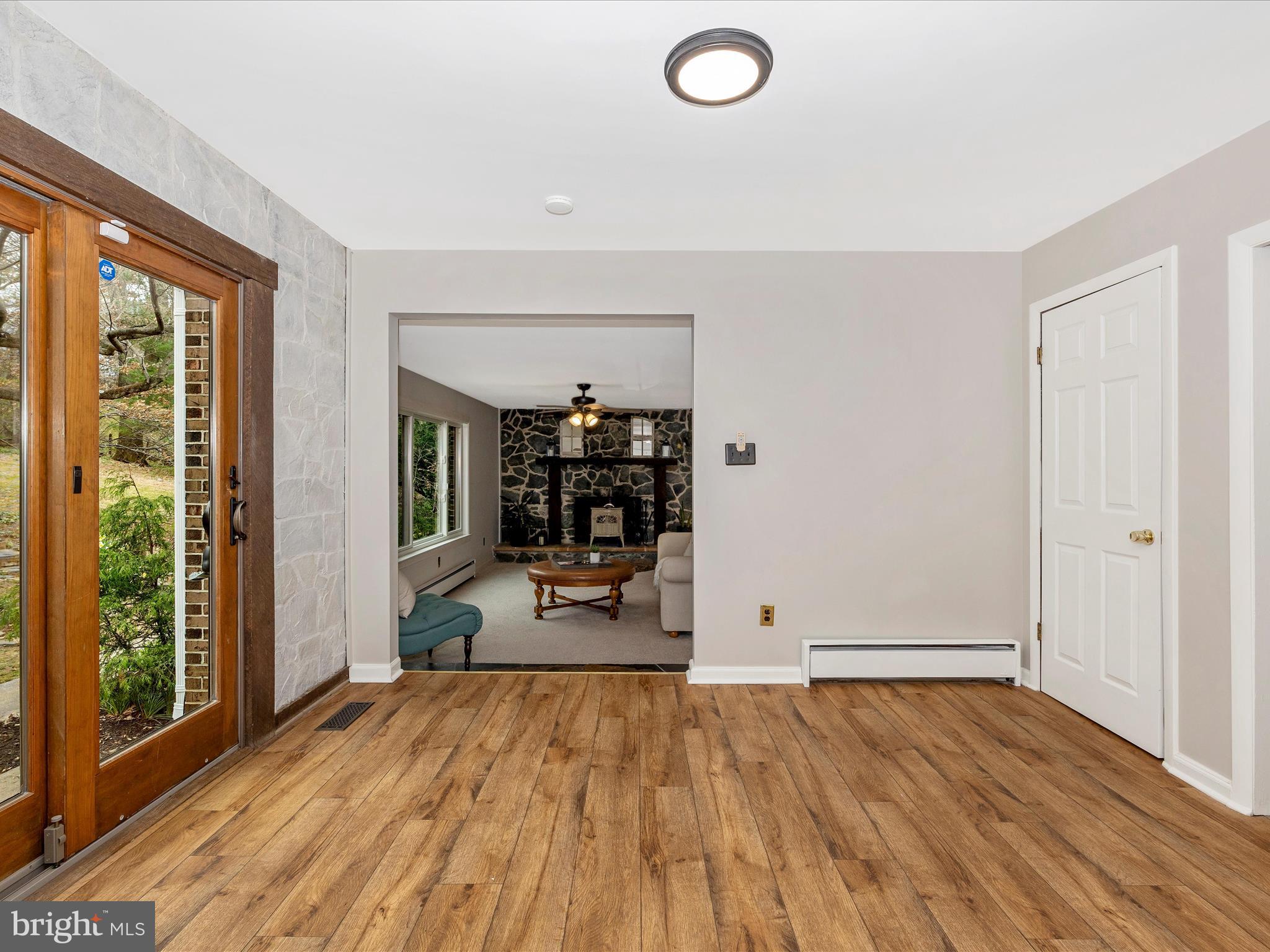4426 Teen Barnes Road Frederick, MD 21703 - Photo 23 of 76 an empty room with wooden floor and windows