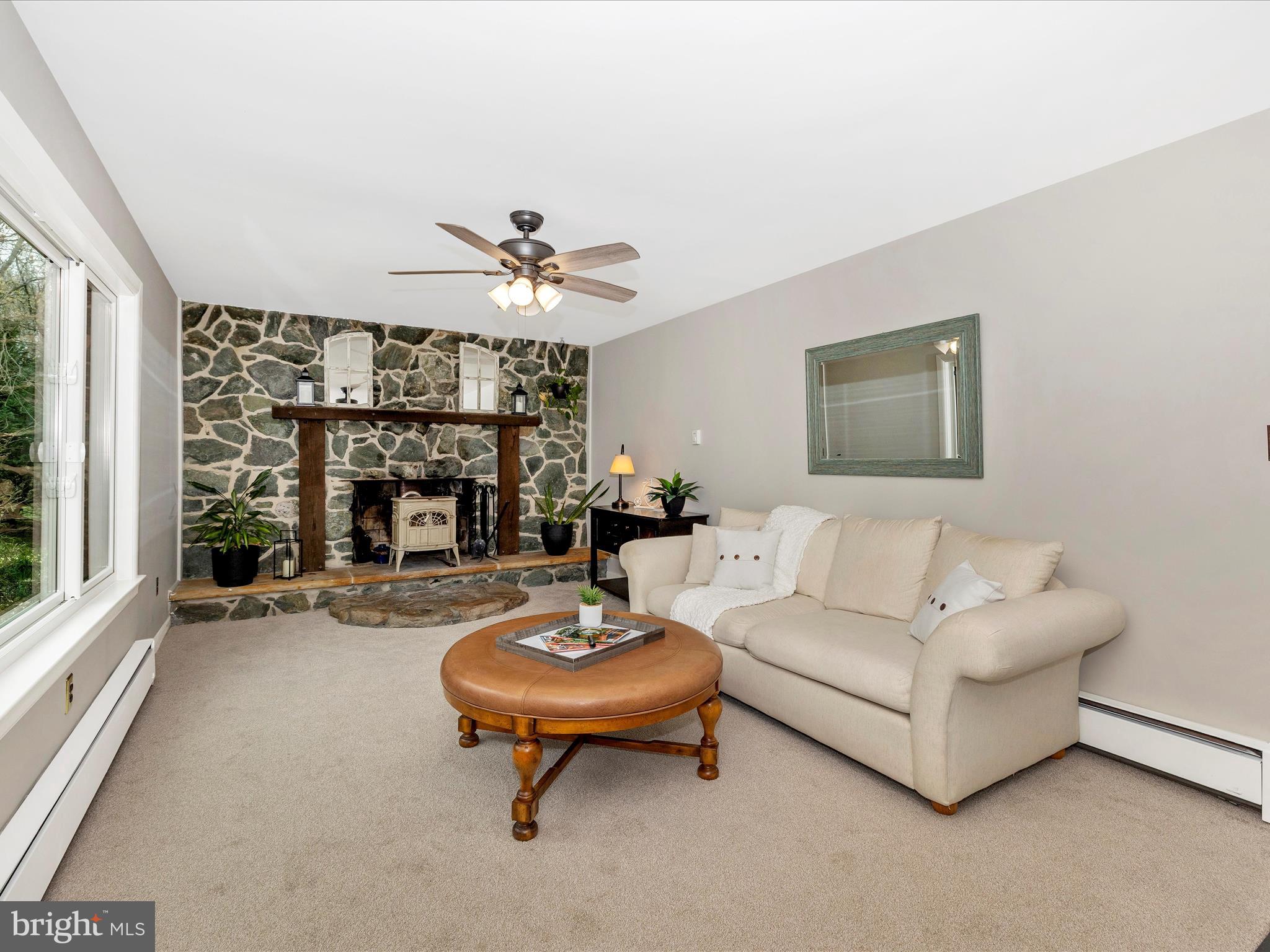 4426 Teen Barnes Road Frederick, MD 21703 - Photo 25 of 76 a living room with furniture and a fireplace