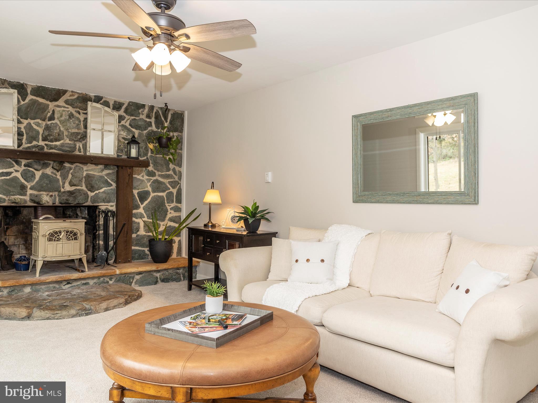 4426 Teen Barnes Road Frederick, MD 21703 - Photo 26 of 76 a living room with furniture and a chandelier