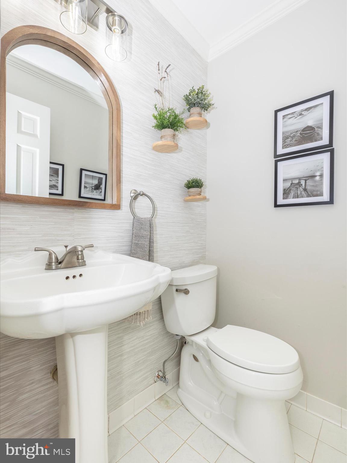 4426 Teen Barnes Road Frederick, MD 21703 - Photo 29 of 76 a bathroom with a sink a toilet and mirror