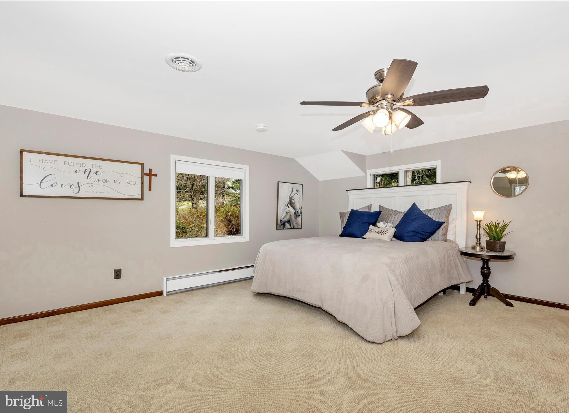 4426 Teen Barnes Road Frederick, MD 21703 - Photo 30 of 76 a spacious bedroom with a bed painting on the wall and a window