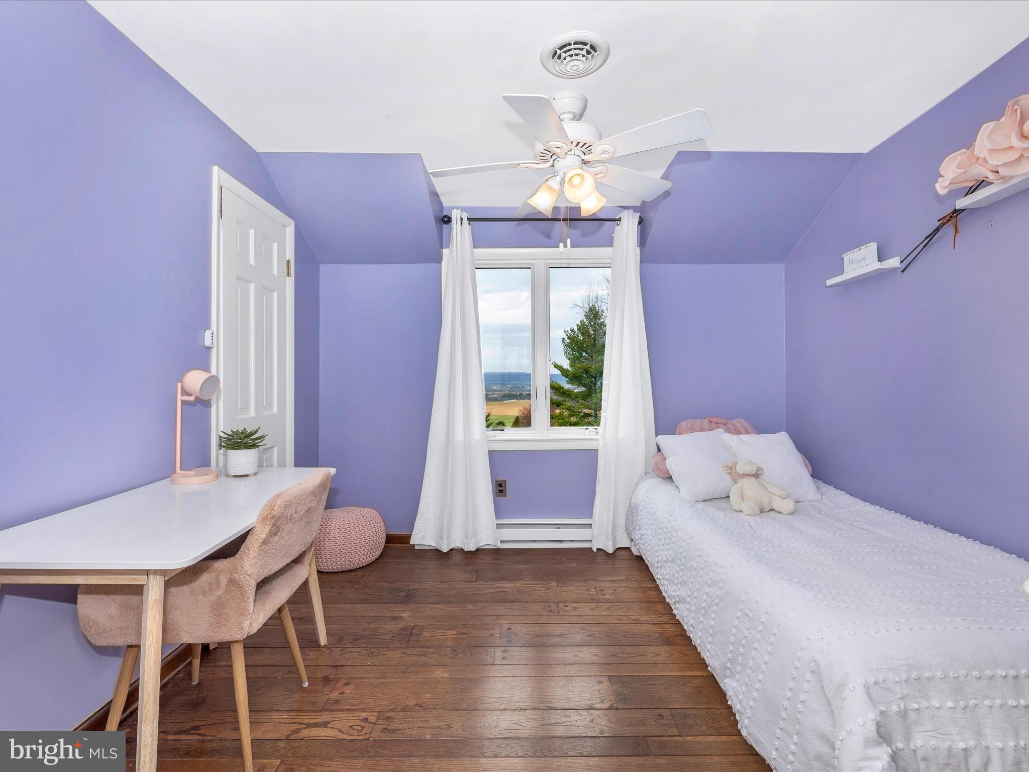 4426 Teen Barnes Road Frederick, MD 21703 - Photo 36 of 76 a bedroom with a bed and wooden floor