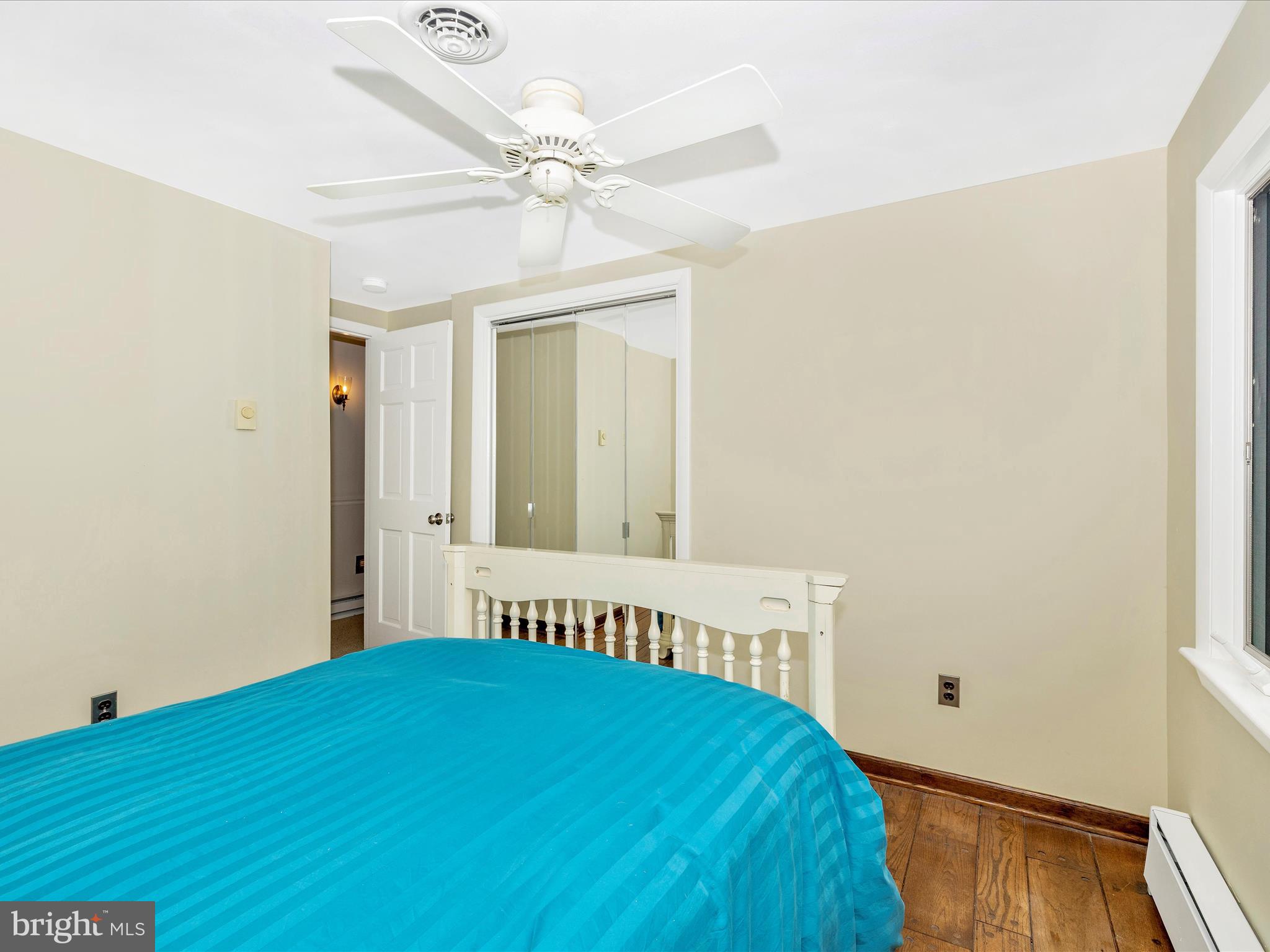 4426 Teen Barnes Road Frederick, MD 21703 - Photo 39 of 76 a bedroom with a bed and a chandelier