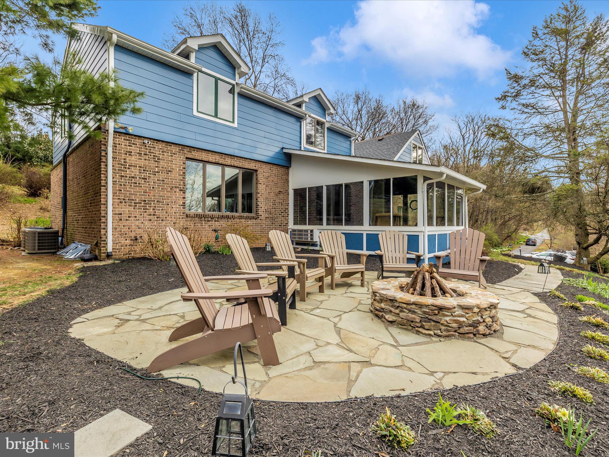 4426 Teen Barnes Road Frederick, MD 21703 - Photo 50 of 76 a view of a patio with table and chairs with wooden fence and plants