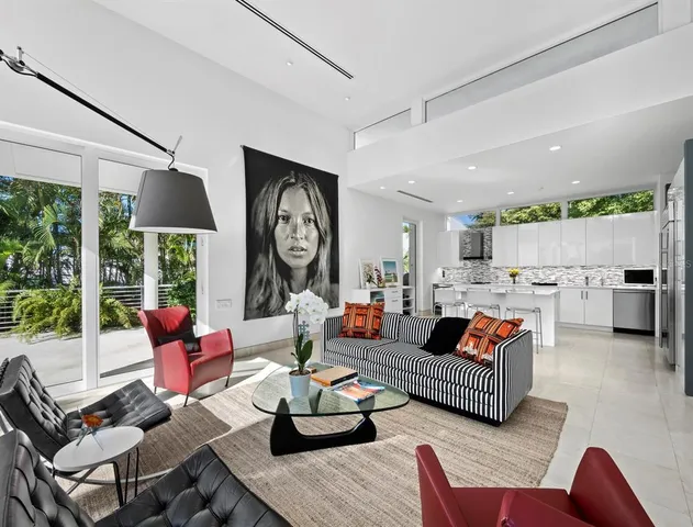 a living room with furniture workspace and a bookshelf