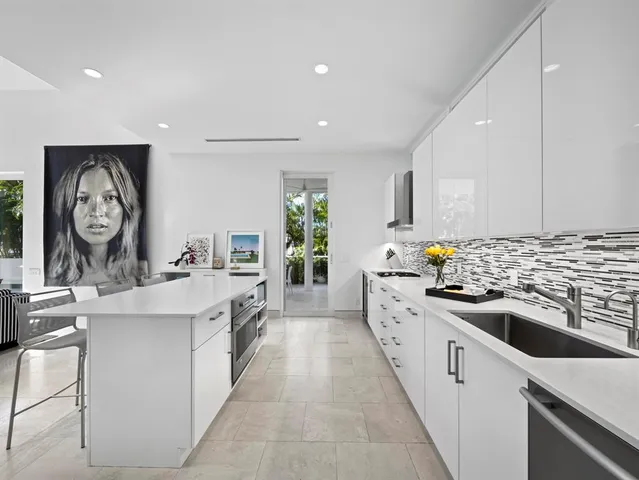 a view of a flesh room with furniture and floor to ceiling window
