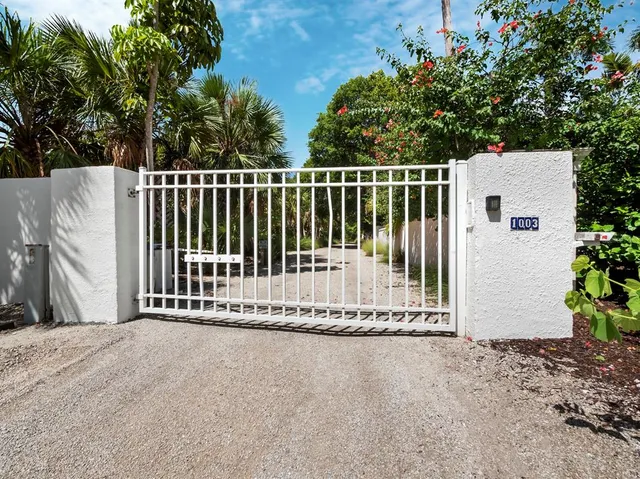 an aerial view of residential building and ocean view
