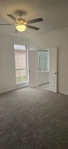 an empty room with a empty space and a window