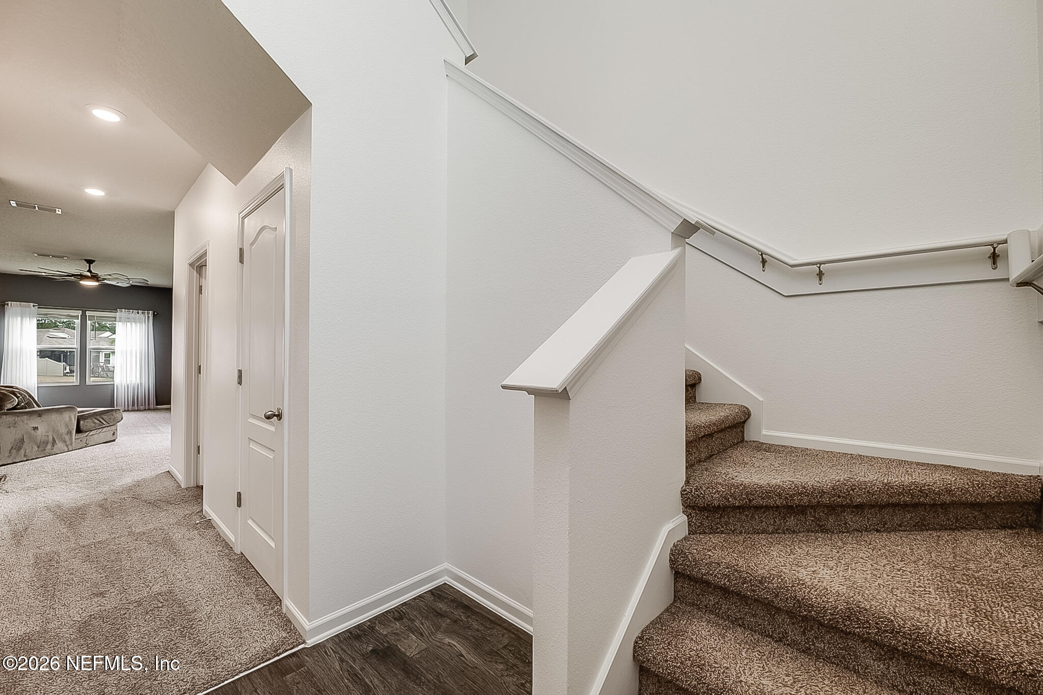 266 Caminha Road St. Augustine, FL 32084 - Photo 12 of 57 a view of hallway with stairs and wooden floor