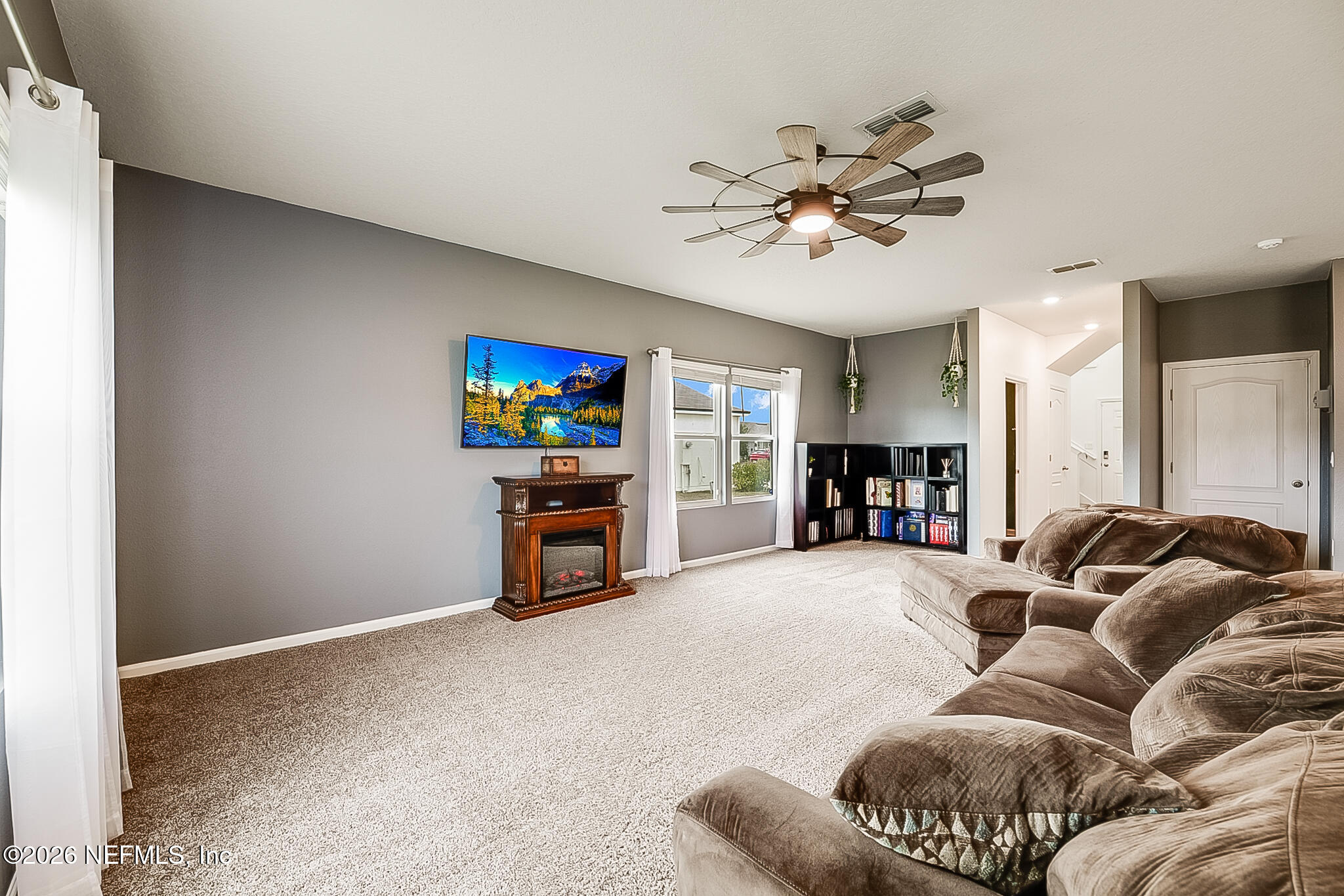 266 Caminha Road St. Augustine, FL 32084 - Photo 15 of 57 a living room with furniture and a flat screen tv