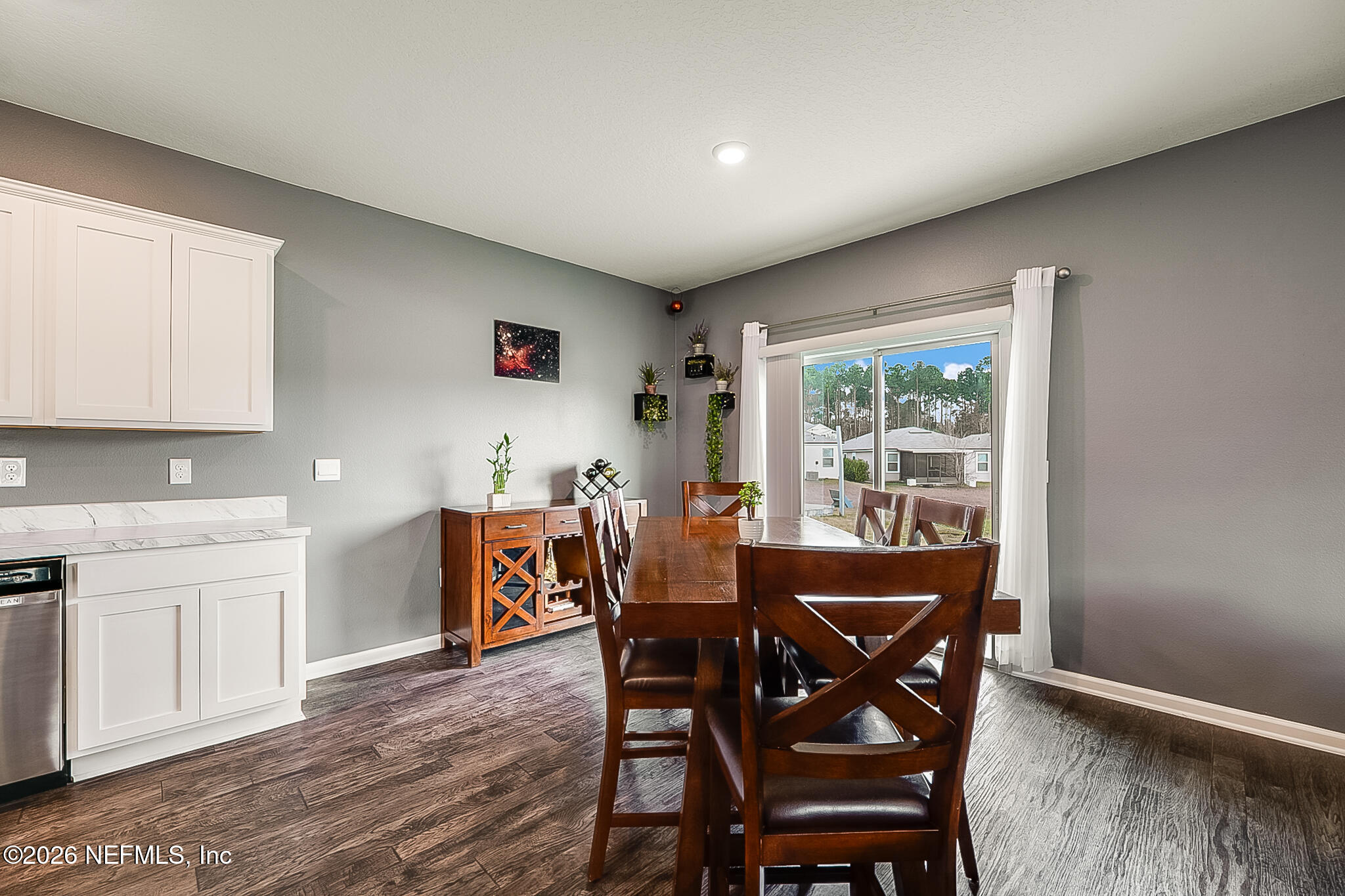 266 Caminha Road St. Augustine, FL 32084 - Photo 16 of 57 a view of a dining room with furniture and wooden floor