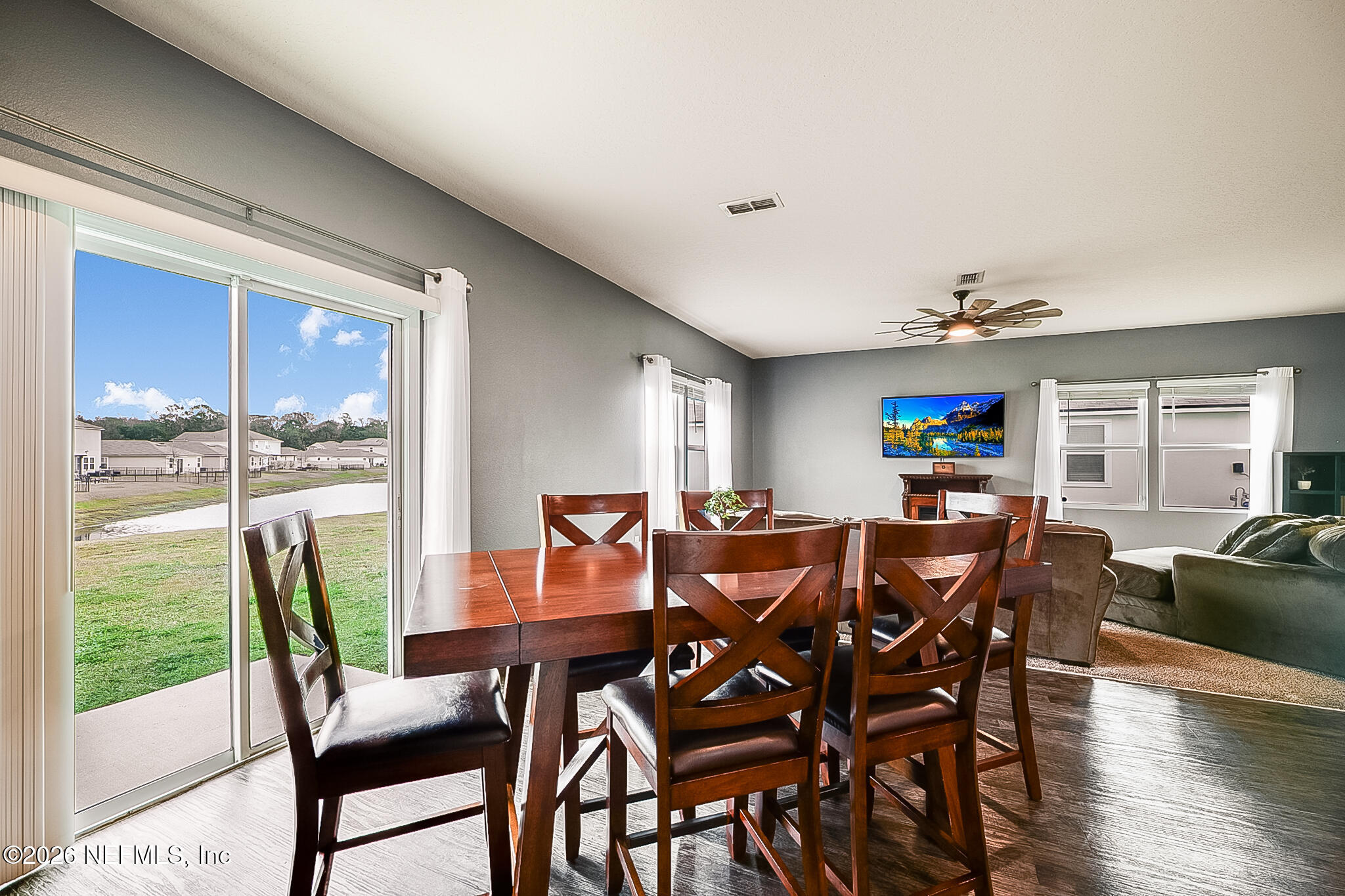 266 Caminha Road St. Augustine, FL 32084 - Photo 17 of 57 a view of a dining room with furniture window and wooden floor