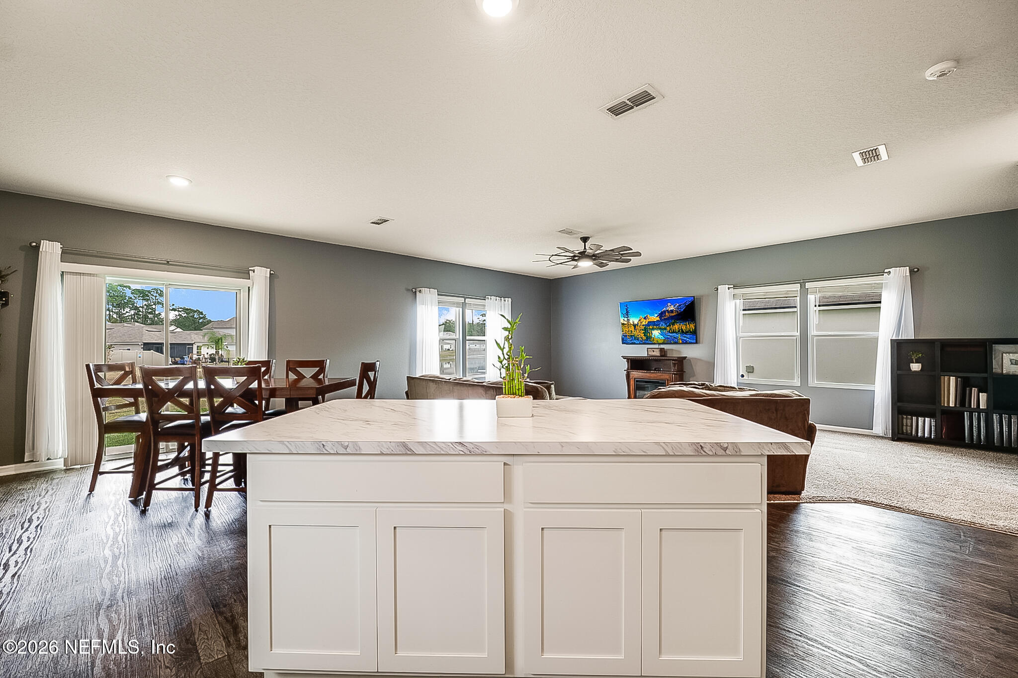 266 Caminha Road St. Augustine, FL 32084 - Photo 21 of 57 a view of a dining room with furniture and wooden floor