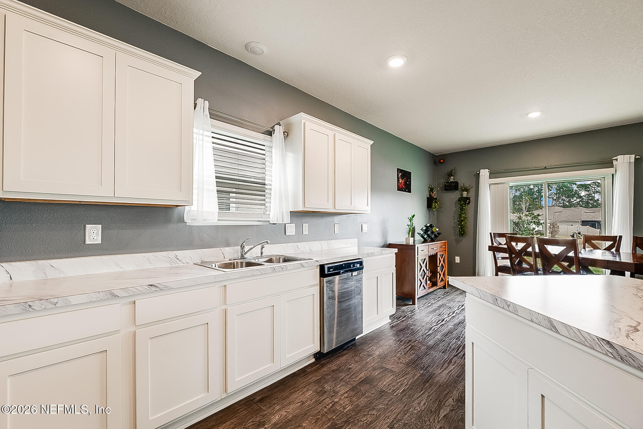 266 Caminha Road St. Augustine, FL 32084 - Photo 22 of 57 a kitchen with a sink stove and cabinets