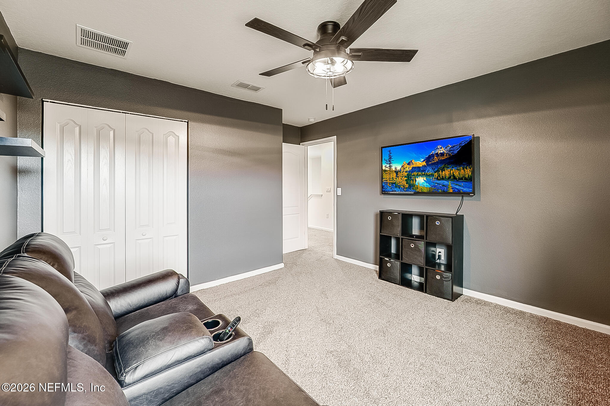 266 Caminha Road St. Augustine, FL 32084 - Photo 29 of 57 a living room with furniture and a flat screen tv