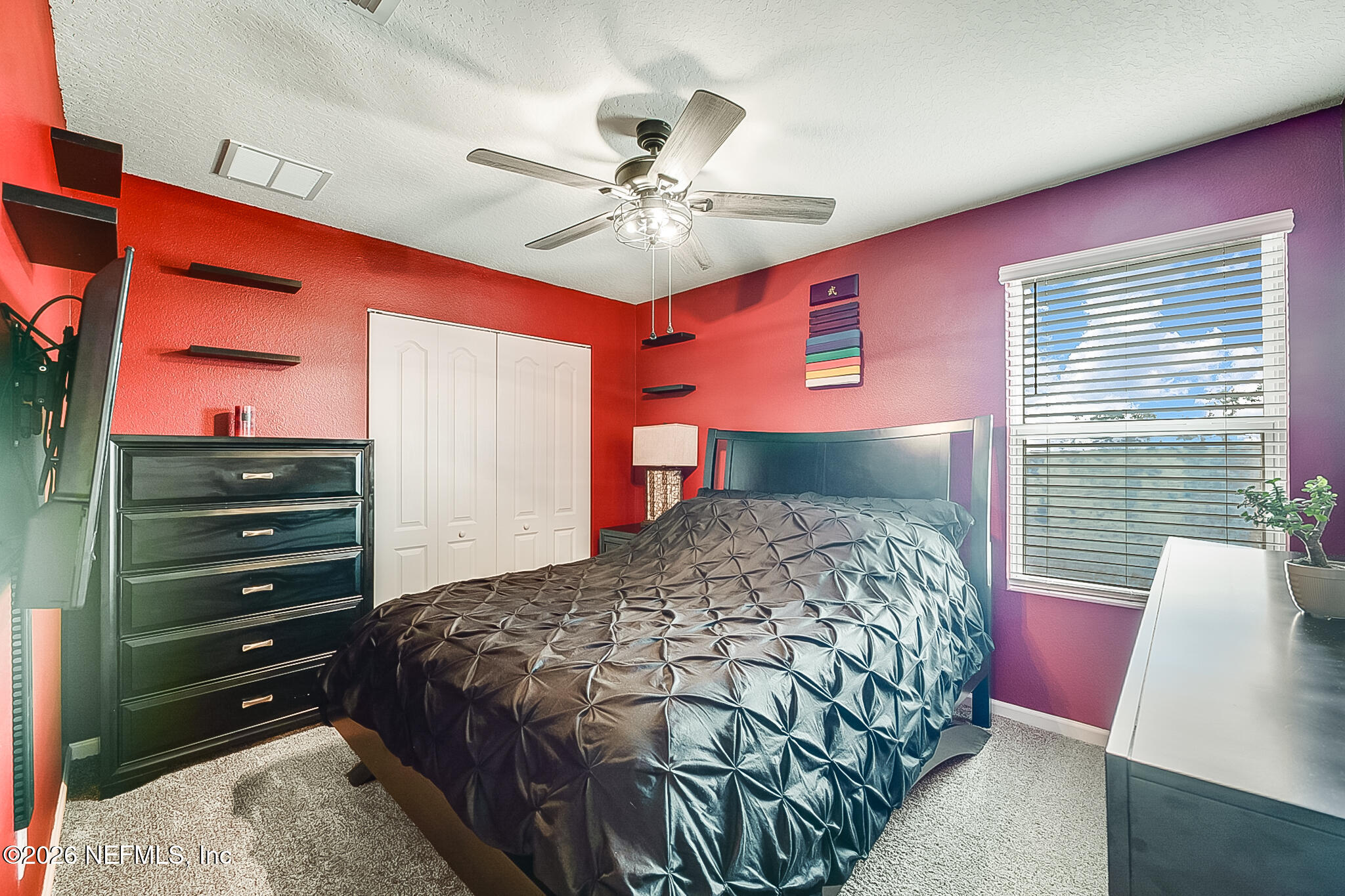 266 Caminha Road St. Augustine, FL 32084 - Photo 30 of 57 a bedroom with a bed and a chandelier