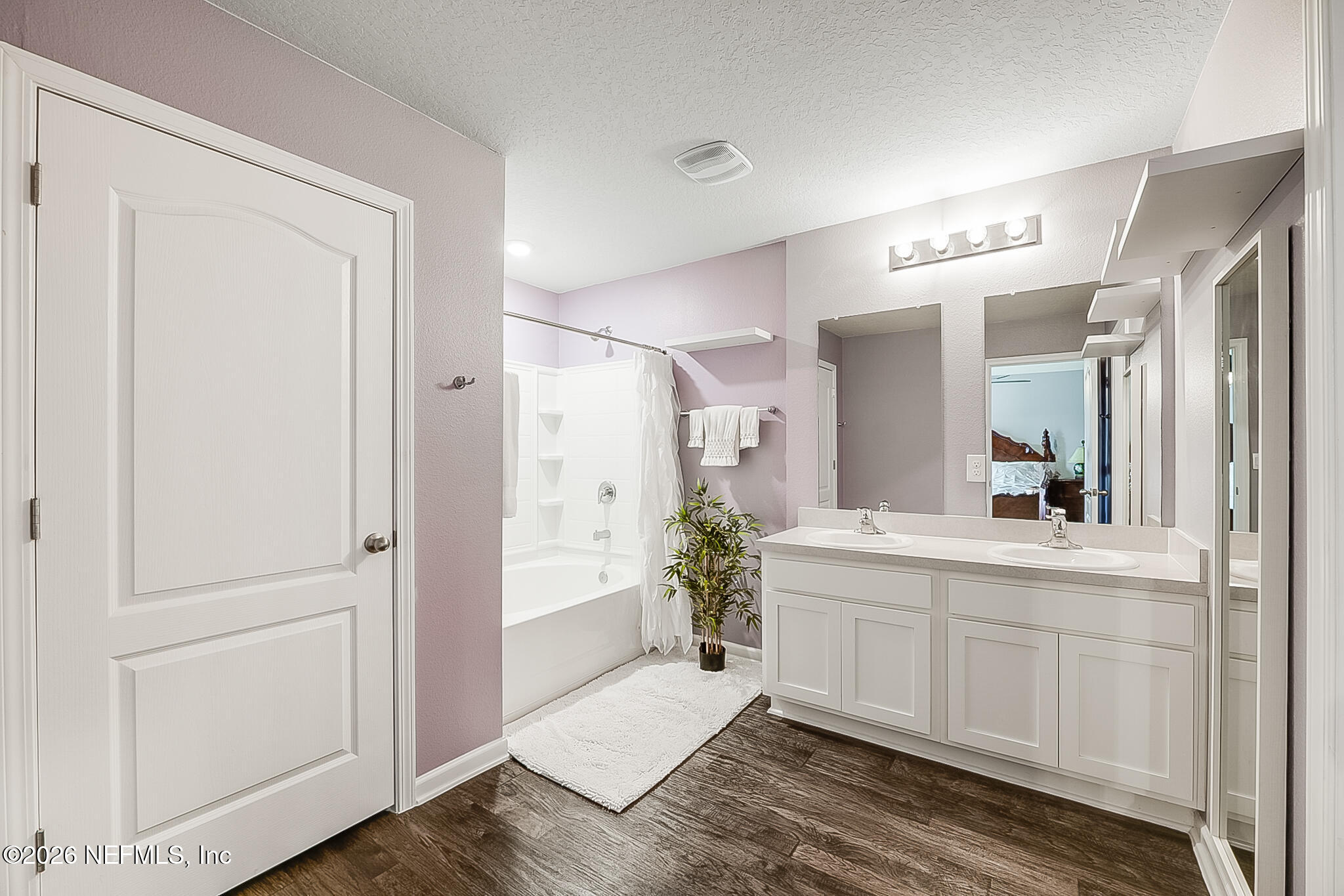 266 Caminha Road St. Augustine, FL 32084 - Photo 35 of 57 a spacious bathroom with a double vanity sink and a mirror