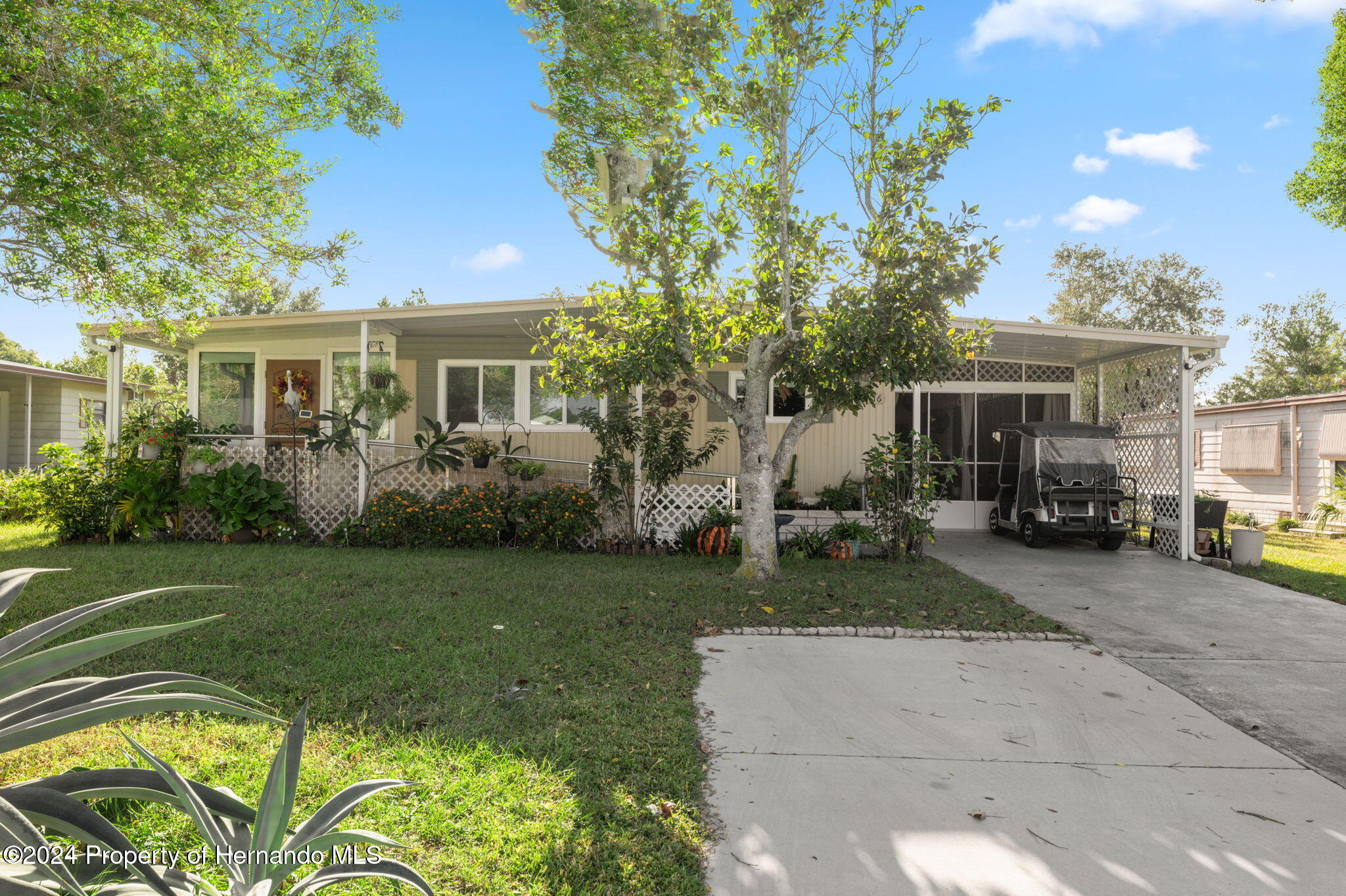 15116 Rialto Avenue Brooksville, FL 34613 - Photo 2 of 36 a front view of house with yard and green space