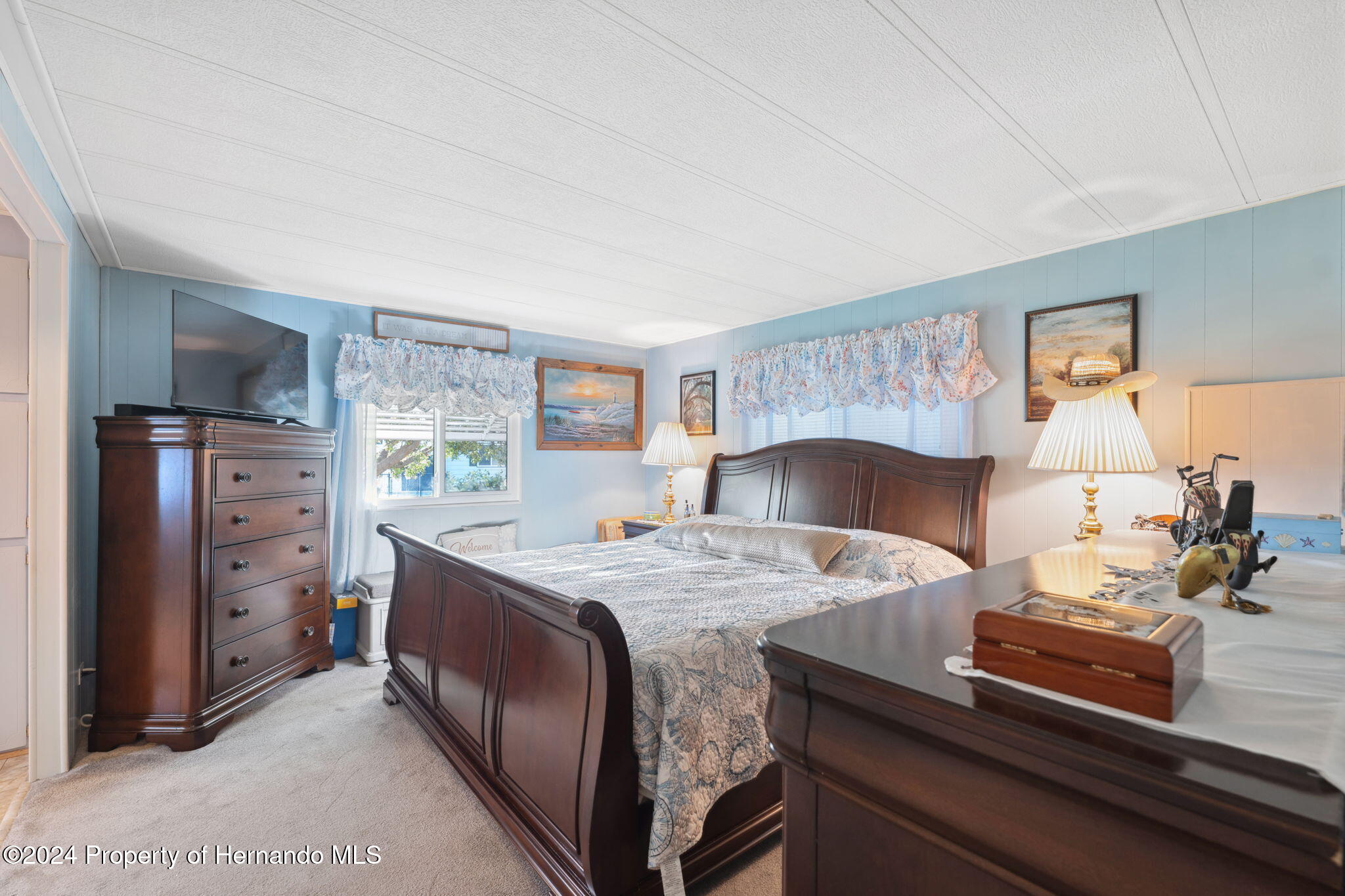 15116 Rialto Avenue Brooksville, FL 34613 - Photo 22 of 36 a bed room with a bed and a table