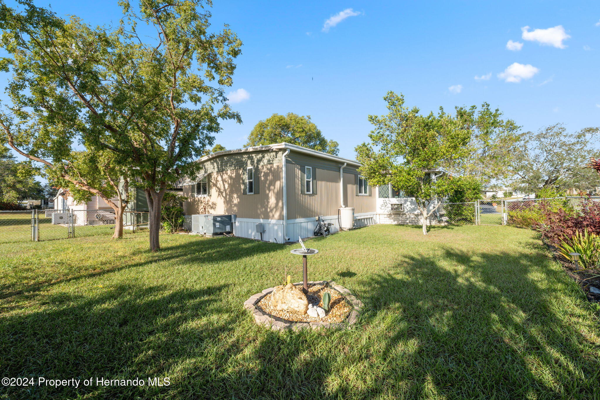 15116 Rialto Avenue Brooksville, FL 34613 - Photo 36 of 36 a view of a house with a yard