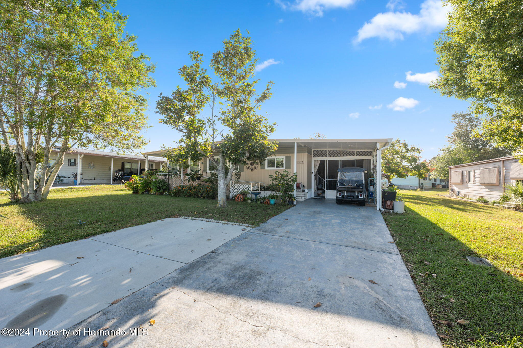 15116 Rialto Avenue Brooksville, FL 34613 - Photo 4 of 36 a view of house with outdoor space and garden