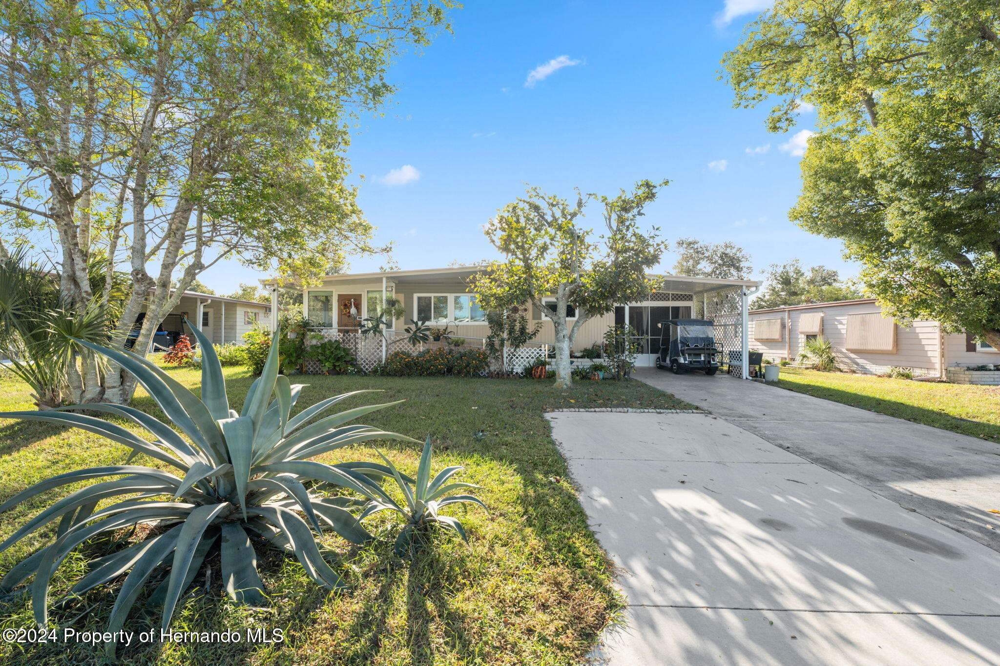 15116 Rialto Avenue Brooksville, FL 34613 - Photo 5 of 36 a view of a house with a swimming pool