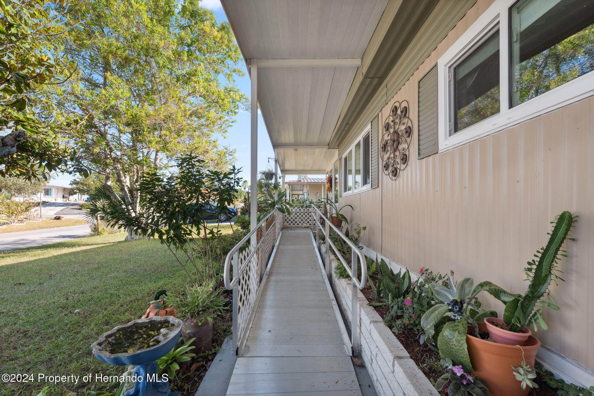 15116 Rialto Avenue Brooksville, FL 34613 - Photo 7 of 36 a view of a house with backyard and garden