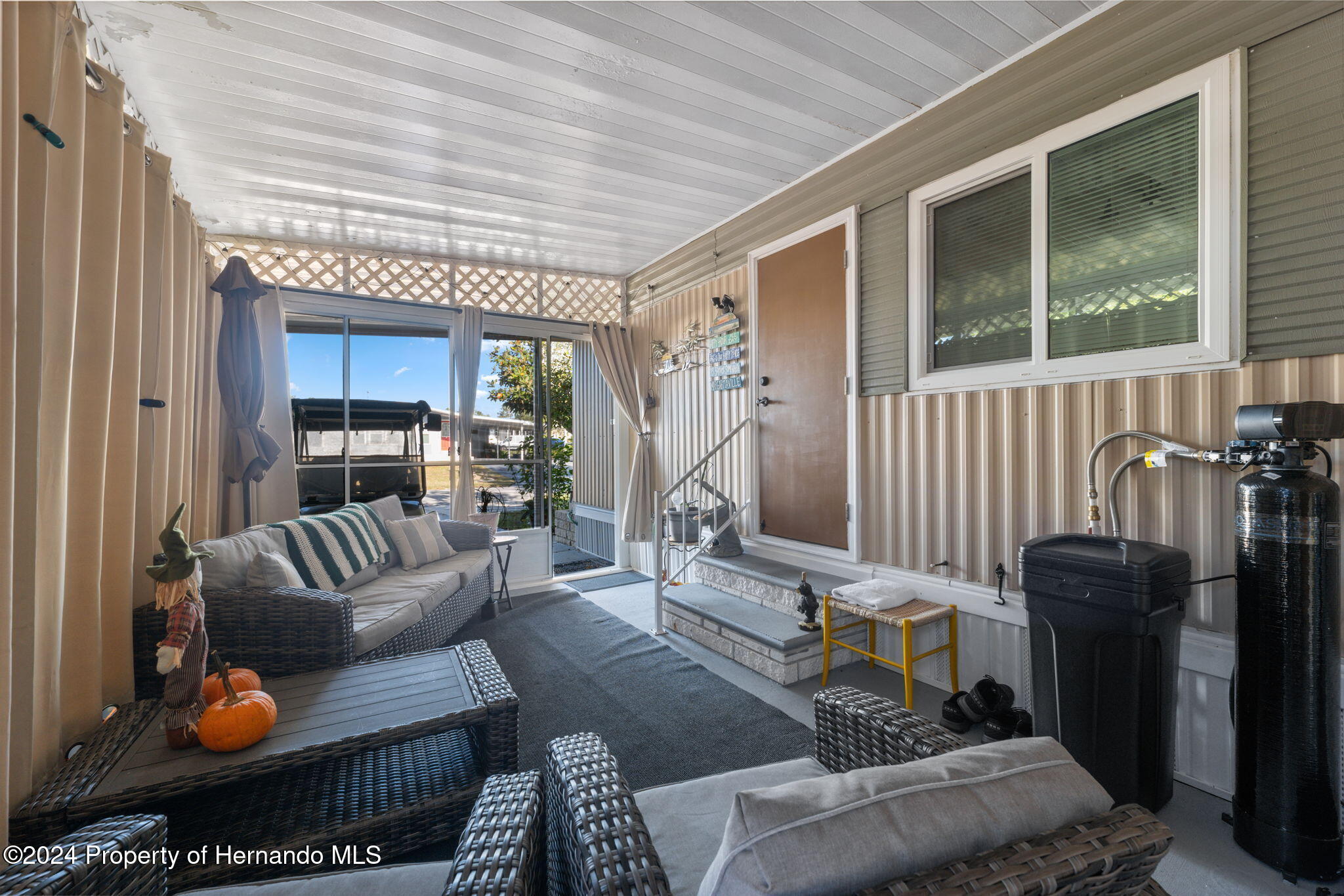 15116 Rialto Avenue Brooksville, FL 34613 - Photo 10 of 36 a living room with furniture and a large window