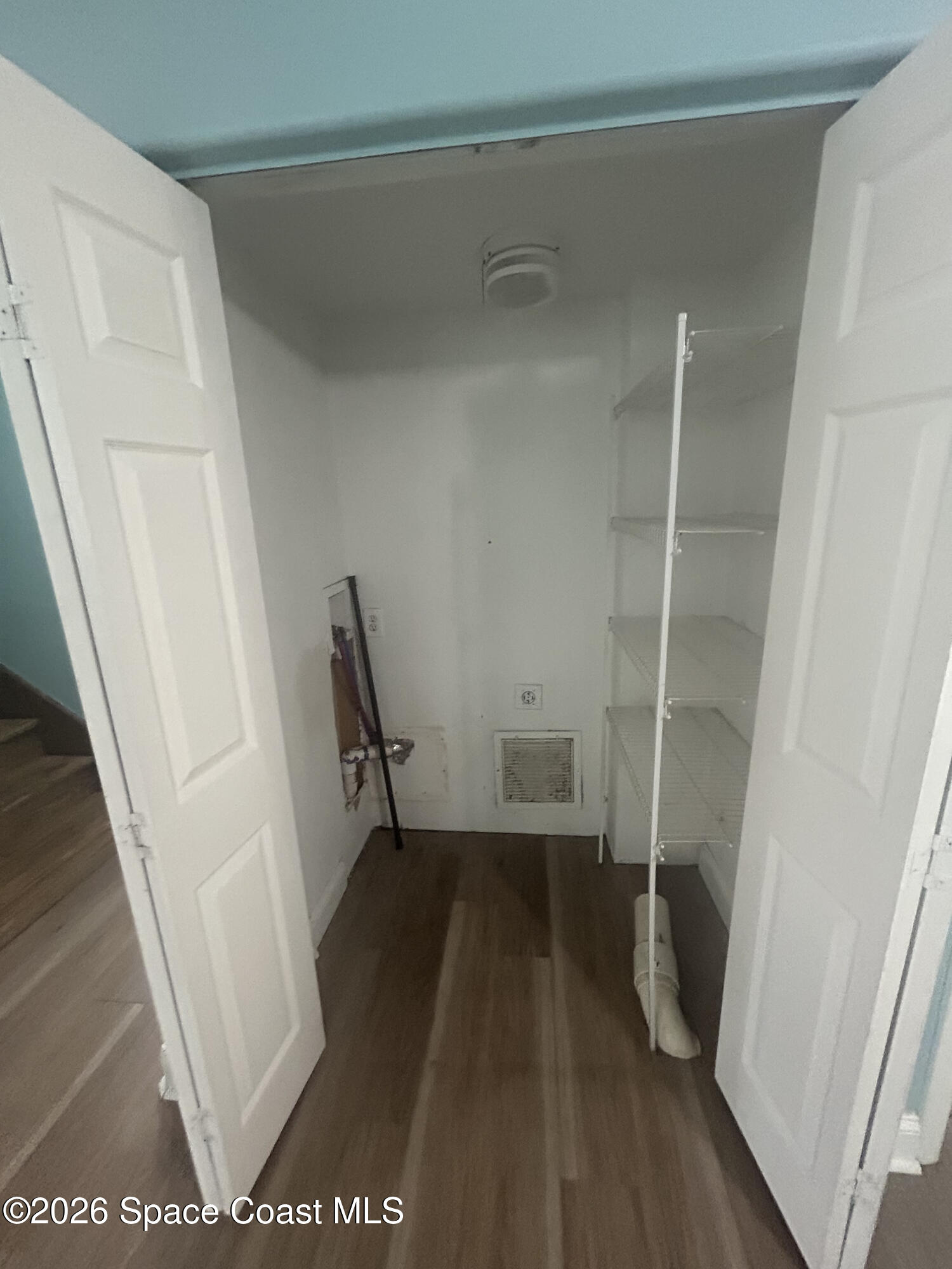 180 Richards Road Melbourne Beach, FL 32951 - Photo 18 of 32 a view of walk in closet with wooden floor