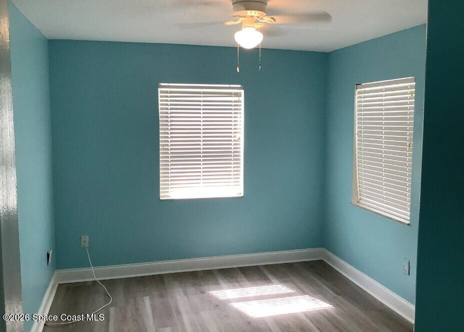 180 Richards Road Melbourne Beach, FL 32951 - Photo 29 of 32 a view of empty room with wooden floor and fan