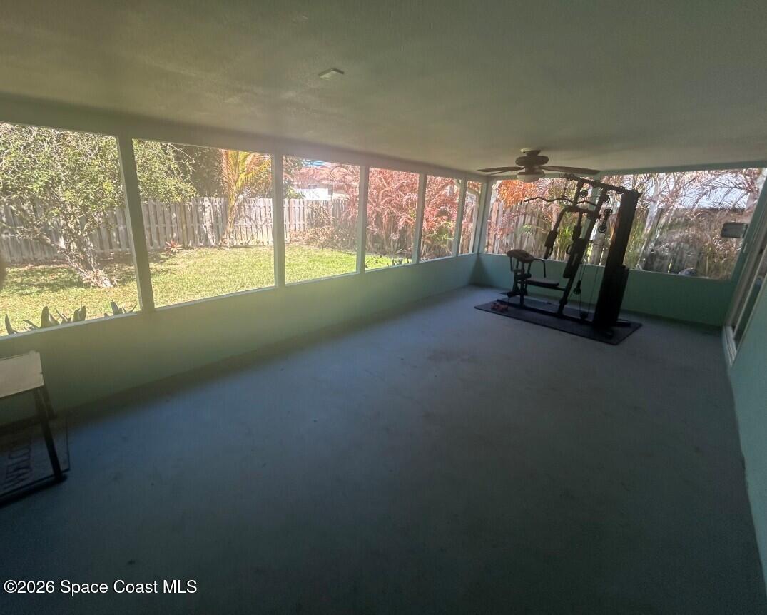 180 Richards Road Melbourne Beach, FL 32951 - Photo 31 of 32 a view of an empty room with a fireplace and a large window
