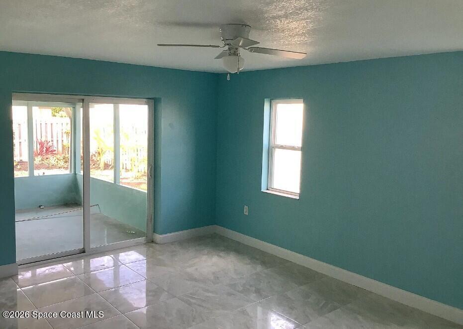 180 Richards Road Melbourne Beach, FL 32951 - Photo 7 of 32 a view of empty room with window