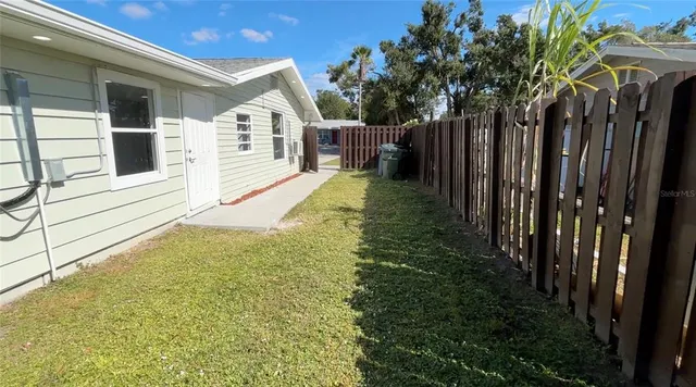 a view of balcony with wooden floor and fence