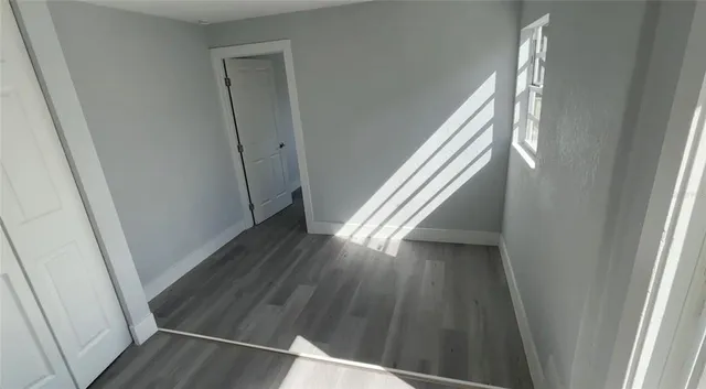 a view of entryway with wooden floor