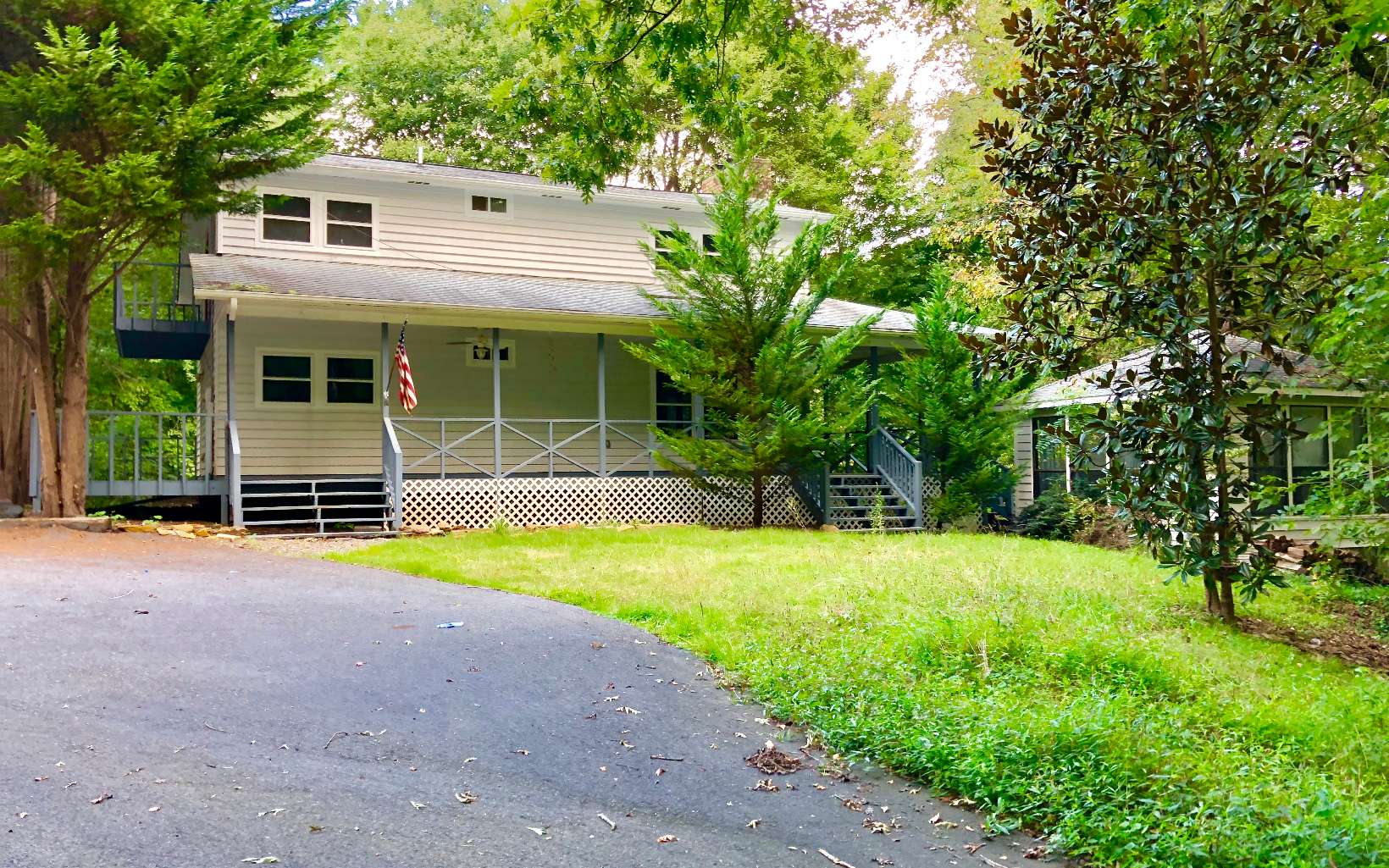 3425 Harshaw Road Murphy, NC 28906 - Photo 1 of 1 a front view of house with yard and trees in the background