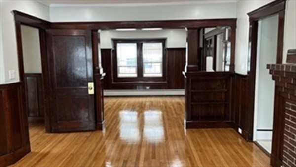 a view of front door with wooden floor