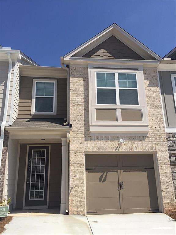 2701 Avanti Way Decatur, GA 30035 - Photo 1 of 3 a front view of a house with a yard