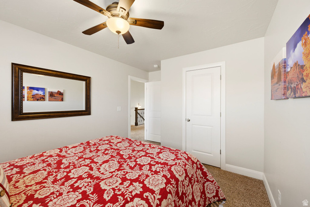 4269 Razor Drive Washington, UT 84780 - Photo 24 of 50 Bedroom featuring light carpet and a ceiling fan