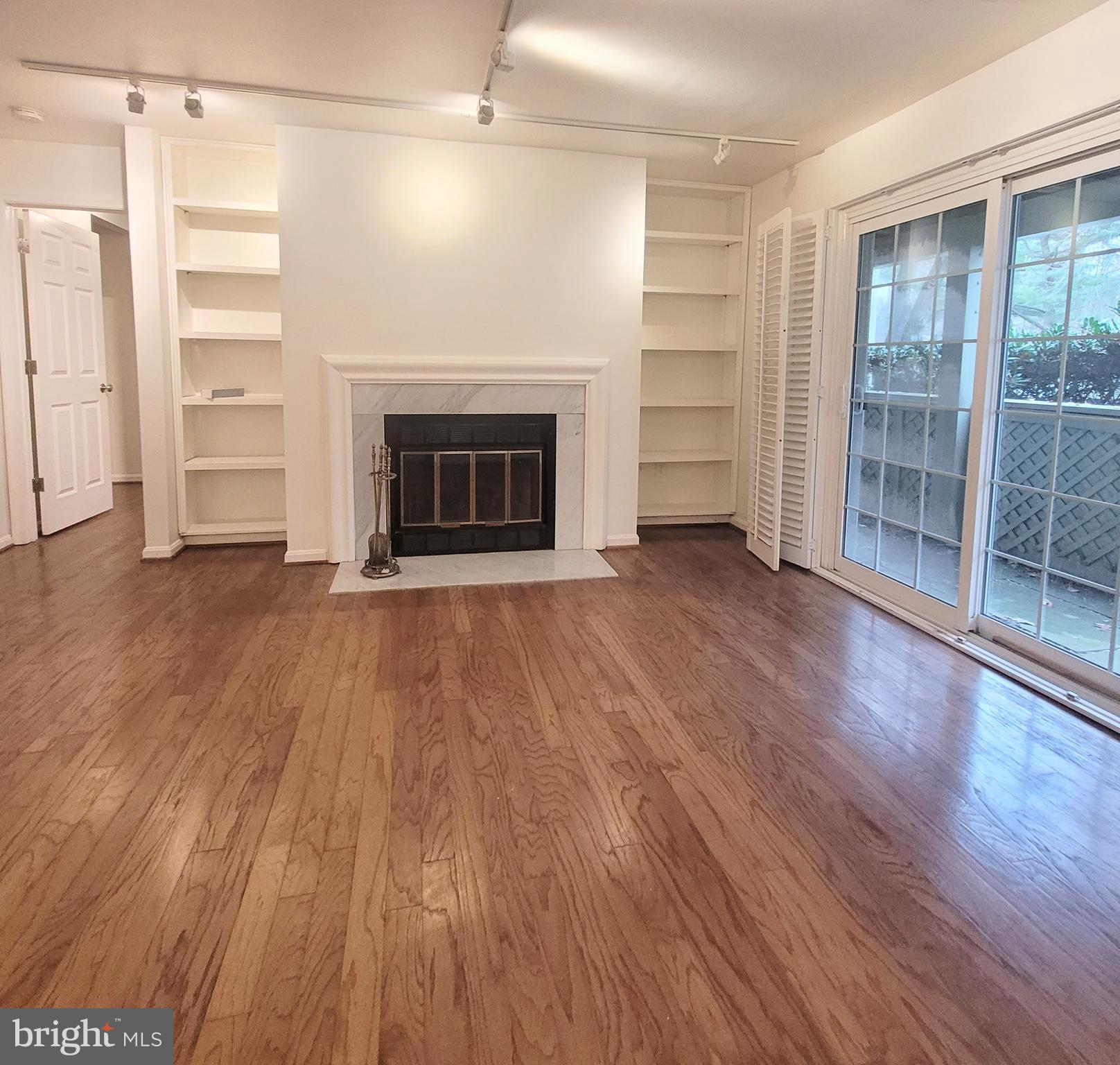 Living room with wood burning fireplace.