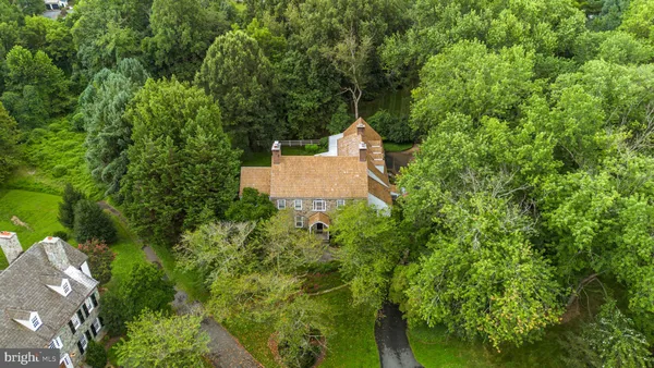 an aerial view of a house with yard