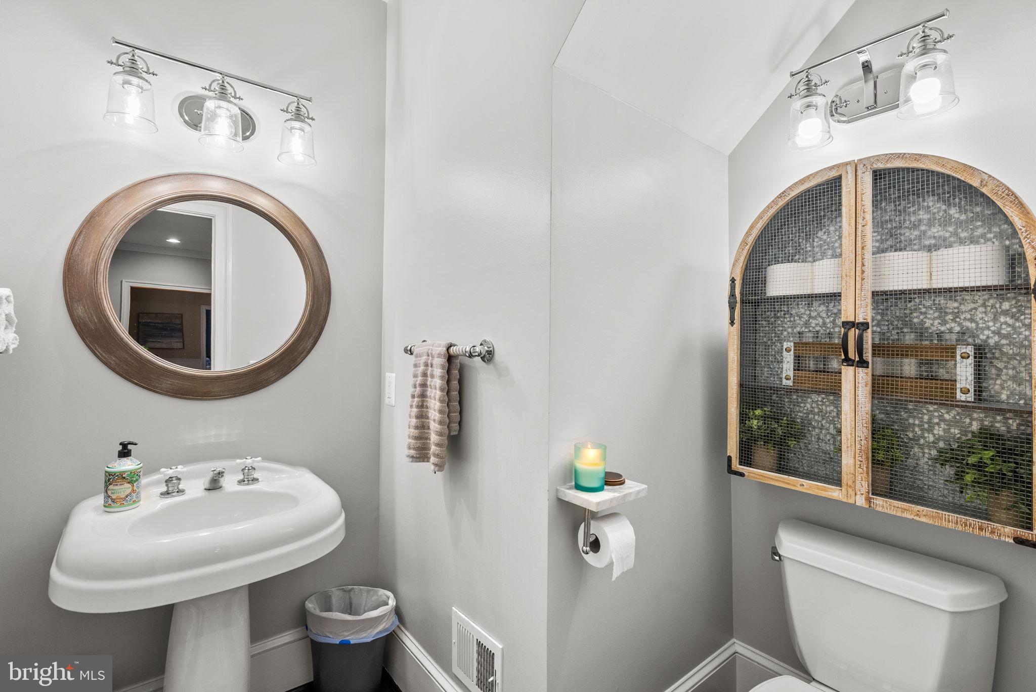 10306 Cutters Lane Potomac, MD 20854 - Photo 13 of 76 a bathroom with a sink and a mirror