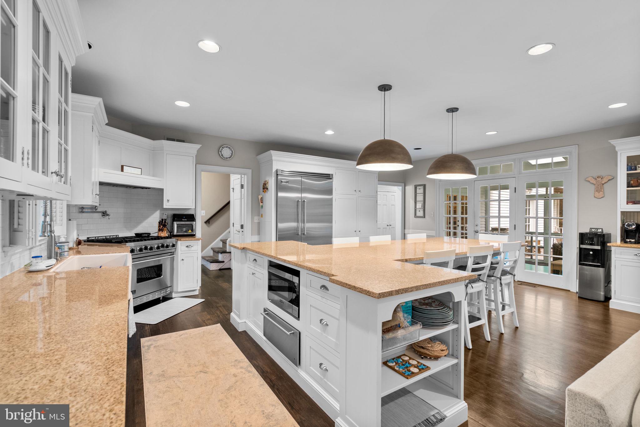 10306 Cutters Lane Potomac, MD 20854 - Photo 16 of 76 a kitchen with stainless steel appliances granite countertop a stove and a refrigerator