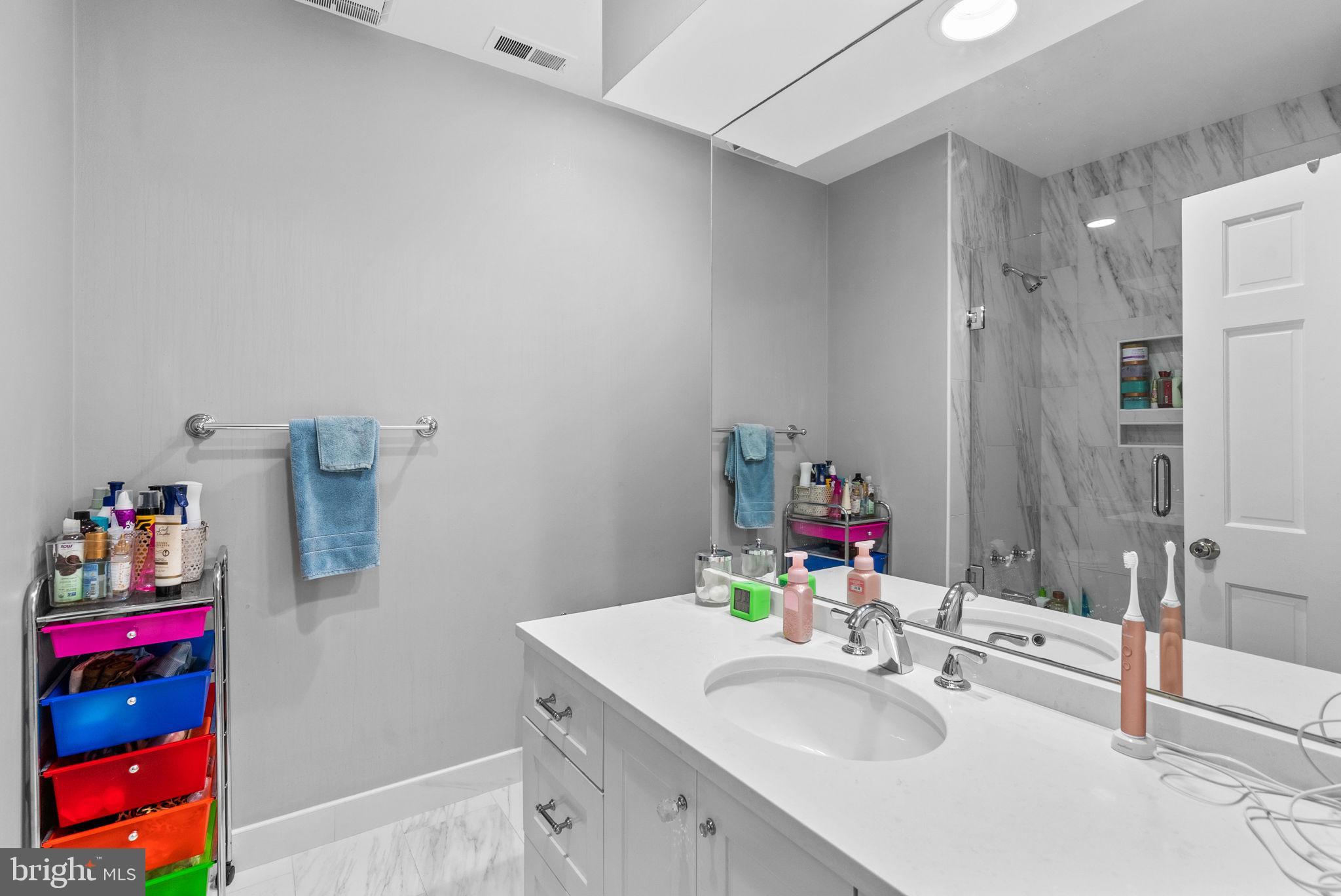 10306 Cutters Lane Potomac, MD 20854 - Photo 44 of 76 a bathroom with a sink vanity mirror and vanity