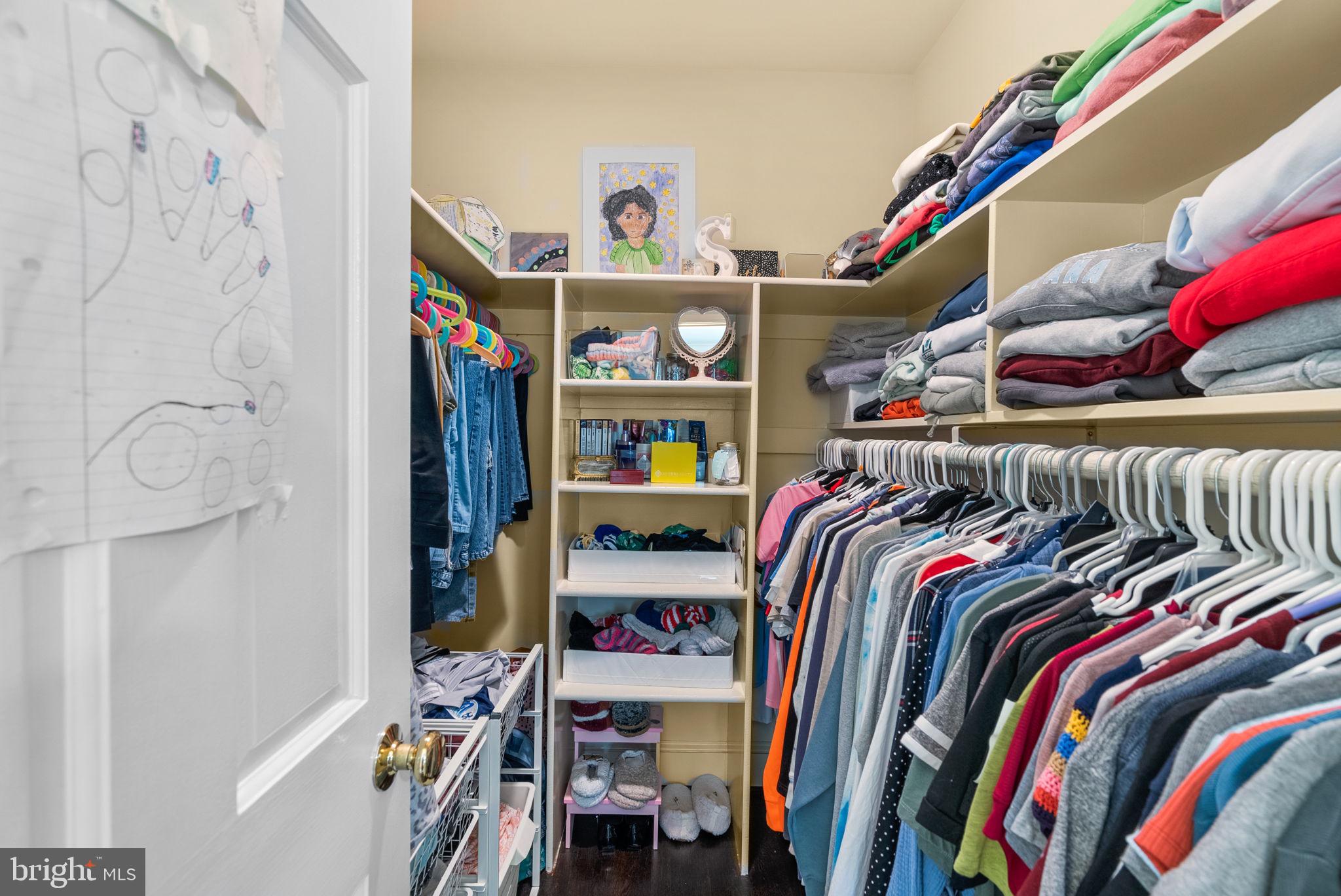 10306 Cutters Lane Potomac, MD 20854 - Photo 52 of 76 a view of walk in closet with clothes and shoes