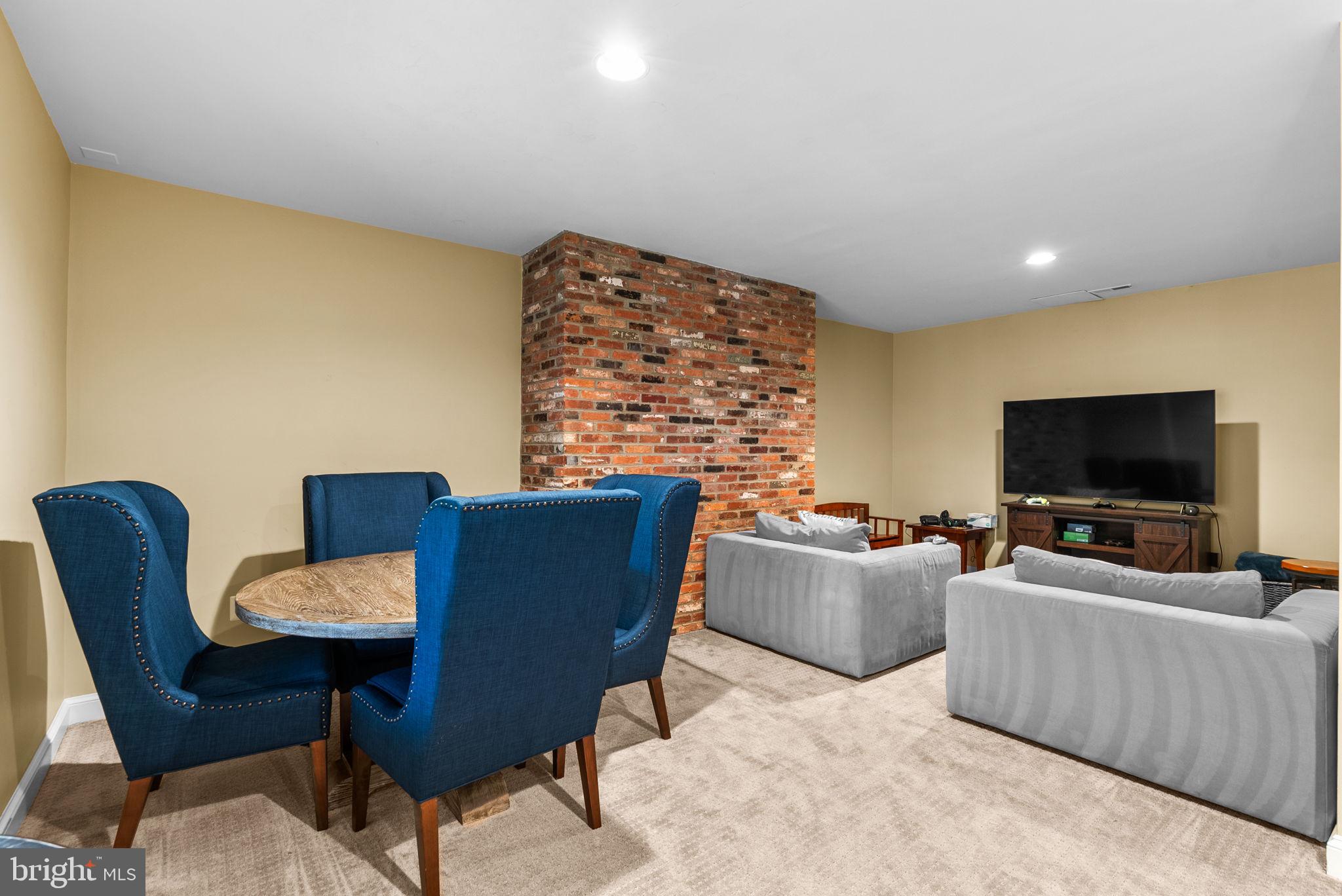 10306 Cutters Lane Potomac, MD 20854 - Photo 59 of 76 a living room with furniture and a flat screen tv