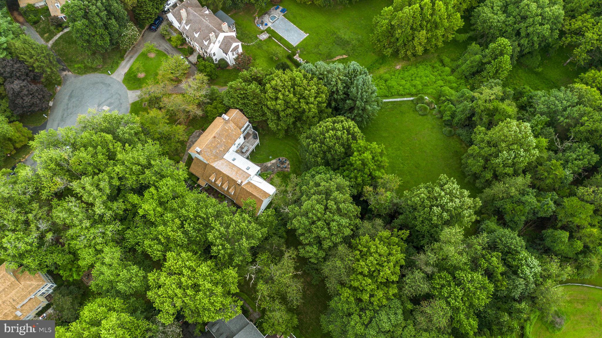 10306 Cutters Lane Potomac, MD 20854 - Photo 75 of 76 an aerial view of a house with a yard and trees