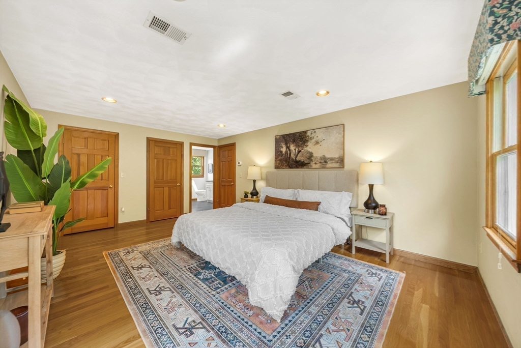 83 Jefferson Road Franklin, MA 02038 - Photo 13 of 34 a bedroom with a large bed rug and wooden floor