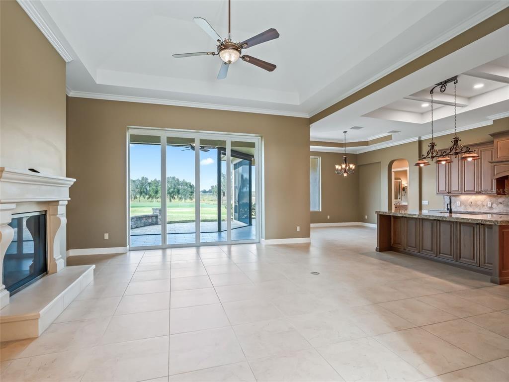 7549 Northwest 33rd Place Ocala, FL 34482 - Photo 12 of 83 a view of an empty room with a fireplace and a window