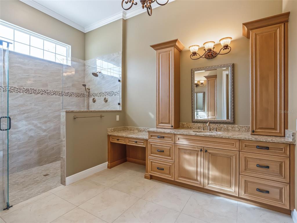 7549 Northwest 33rd Place Ocala, FL 34482 - Photo 38 of 83 a bathroom with a sink a vanity and a mirror